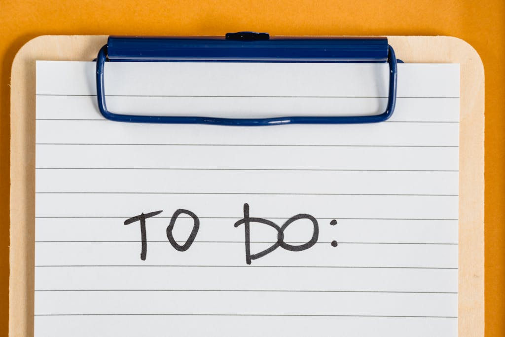 Clean and simple image of a to-do list on a clipboard with lined paper.