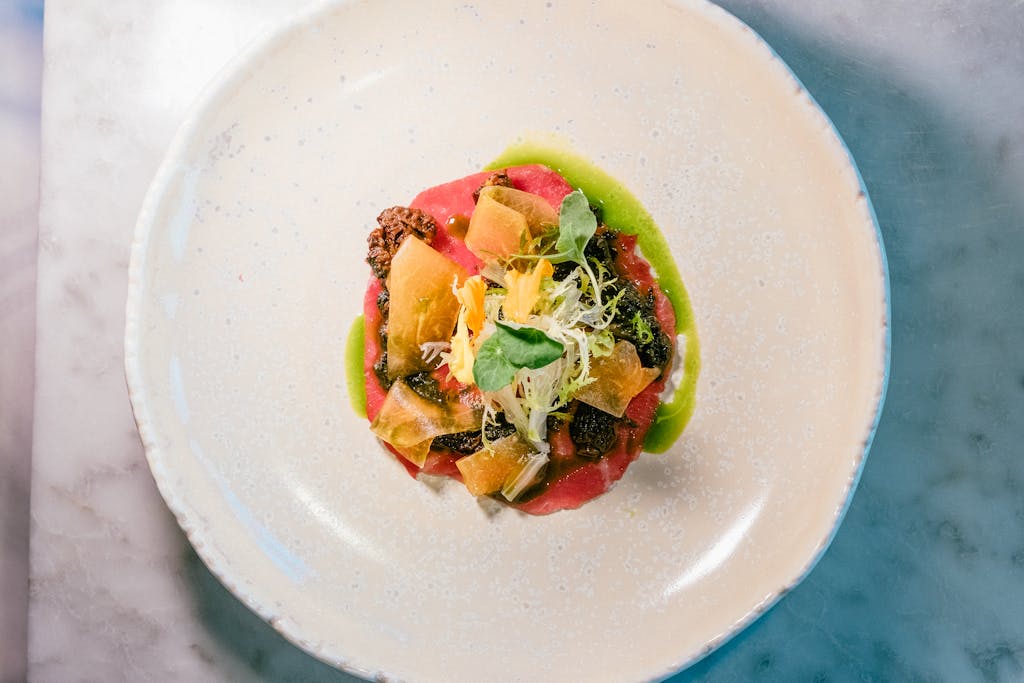 Exquisite gourmet dish on elegant plate showcasing fine dining artistry.